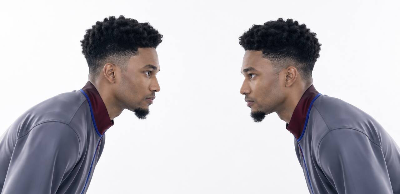Two of him in a staring contest, facing off